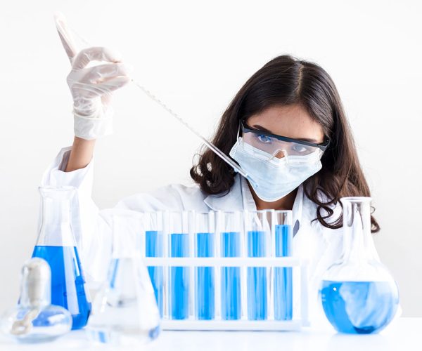 girl putting something in flasks